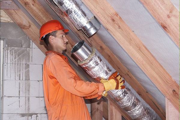 Air Duct Services professional with orange uniform in Zachary